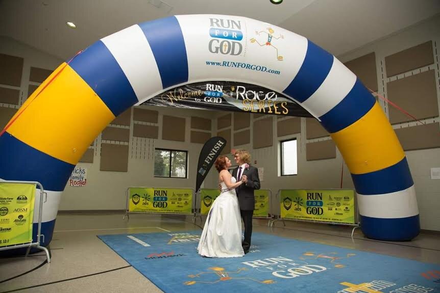 Michael and Lori’s first dance under the finish line inflatable archway!