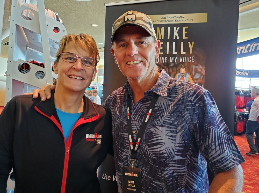 Karen with Mike Reilly, “The Voice of Ironman”